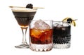 Set of Black Russian cocktails in crystal-clear glass sits against a white background