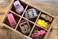 Set of stylish vintage belts in wooden crate Royalty Free Stock Photo