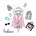 A set of stylish women`s clothing and accessories. Jacket, coat, shoes, bag, shoes, hat, glass of coffee and perfume. Autumn. Royalty Free Stock Photo