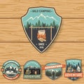 Set of Summer camp badges on the wood board. Vector. Royalty Free Stock Photo