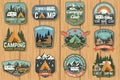 Set of Summer camp badges on the wood board. Vector. Royalty Free Stock Photo