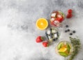 Set of summer healthy cocktails, various citrus infused waters, lemonades or mojitos, with lime and blueberries, orange and strawb