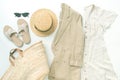 Set of summer linnen outfin with dress, jacket, glases and shoes Royalty Free Stock Photo