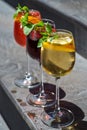 Set of summer refreshments on a stone background with copy space. three glasses of red, yellow and orange lemonade. Royalty Free Stock Photo