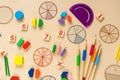 Set of supplies for mathematics and for school. Fractions, rulers, pencils, notepad on beige background. Back to school