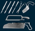 Set of surgical cutting tools. Reusable scalpels, Liston amputation knife , metacarpal saw, straight scissors, saw sheet Royalty Free Stock Photo