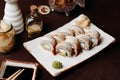 Set of sushi golden dragon on a clay plate Royalty Free Stock Photo
