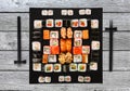 Set of sushi, maki and rolls on blue wood background Royalty Free Stock Photo