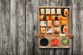 Set of sushi maki and rolls at box on wood. Royalty Free Stock Photo