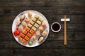 Set of sushi maki and rolls at wood background Royalty Free Stock Photo