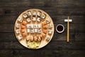 Set of sushi maki and rolls at wood background Royalty Free Stock Photo