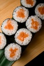 Set of sushi with red sea fish and white rice on a wooden board Royalty Free Stock Photo