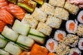 Set of sushi and rolls close-up background, delivery from a restaurant. Salmon, unagi, california and other delicious foods Royalty Free Stock Photo