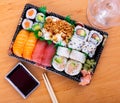 Set of sushi rolls and nigiri with salmon, tuna, avocado and fried onions Royalty Free Stock Photo