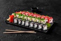 Set of sushi rolls with salmon, eel, avocado, cream cheese, masago and sesame Royalty Free Stock Photo