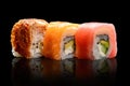 Set of sushi and rolls with salmon, eel and tuna, side view. Japanese food Royalty Free Stock Photo