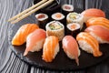 Set of sushi and rolls with salmon and tuna, avocado, california Royalty Free Stock Photo