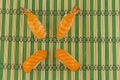 Set sushi shrimp and salmon fresh nigiri on green bamboo background