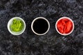 Set for sushi soy sauce ginger wasabi with chopstick on stone background Royalty Free Stock Photo