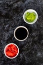 Set for sushi soy sauce ginger wasabi with chopstick on stone background Royalty Free Stock Photo