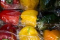 Set of sweet peppers of different colors from local market in plastic shopping bag. Top view. Organic food. Plastic Pollution, Royalty Free Stock Photo