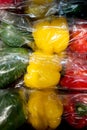Set of sweet peppers of different colors from local market in plastic shopping bag. Top view. Organic food. Plastic Pollution, Royalty Free Stock Photo