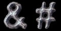 Set of symbols ampersand and hash made of forged metal isolated on black background. 3d