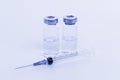 Set of syringe and two vials toned light blue Royalty Free Stock Photo