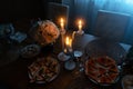 A set table with lighted candles, a romantic dinner