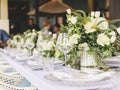 Set table for a white and aqua blue wedding dinner decorated Royalty Free Stock Photo