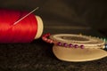 Set tailor: red thread with a needle, white chalk for drawing