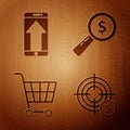 Set Target with dollar symbol, Smartphone, mobile phone, Shopping cart and Magnifying glass and dollar on wooden Royalty Free Stock Photo