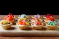 Set of tartlets, tapas, light snacks, beer or wine or cider, black background