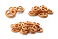 Set of tasty pretzel crackers on background