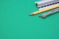 Set of technical drawing tools on a green background with a copy space Royalty Free Stock Photo