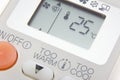 Set temperature at 25 degree on remote control air condition Royalty Free Stock Photo