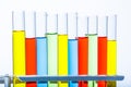 Set of test lab tubes with color liquid on stand Royalty Free Stock Photo