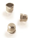 A set of three antique thimbles. Royalty Free Stock Photo