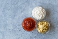 Set of Three Classic Sauce Ketchup, Mayonnaise and Mustard in Small Glass Bowls. Royalty Free Stock Photo