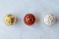 Set of Three Classic Sauce Ketchup, Mayonnaise and Mustard in Small Glass Bowls. Royalty Free Stock Photo