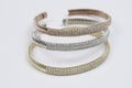 Set of three colored gold diamond bracelets Royalty Free Stock Photo