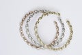 Set of three colored gold and diamond bracelets Royalty Free Stock Photo