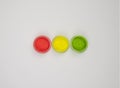 set of three colors of neon colored acrylic powders simulating a traffic light