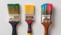 Set of three construction paint brushes with wooden handles isolated on gray