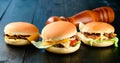 Set of three delicious burgers. The concept of fast food, delicious but unwholesome food Royalty Free Stock Photo