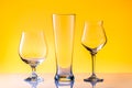 Set with three different empty beer glasses on white golden background. Alcohol concept Royalty Free Stock Photo