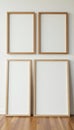 Set of three different sized wooden frames against neutral wall, modern setting, luxury, wall decor Royalty Free Stock Photo