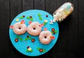 A set of three donuts in the form of pigs. sweets. glaze. delicious product