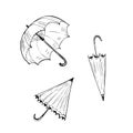 Set of three drawn umbrellas vector illustration. sketchy black and white open monochrome closed umbrellas.