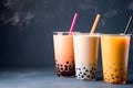 Set of three drinking glasses with straws with Taiwanese bubble or boba tea from vegan milk and agava sypur with different flavors